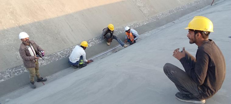 Site Survey & Setting Out — Engineering team recording as-built roof geometry before fabrication