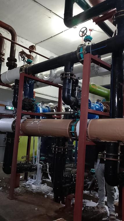 Utility Valve Manifold — Chilled-water headers with valves, supports and insulation